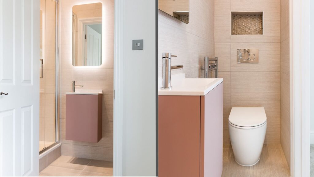 A small, light-colored bathroom with a pink floating vanity. A toilet and shower are also visible.