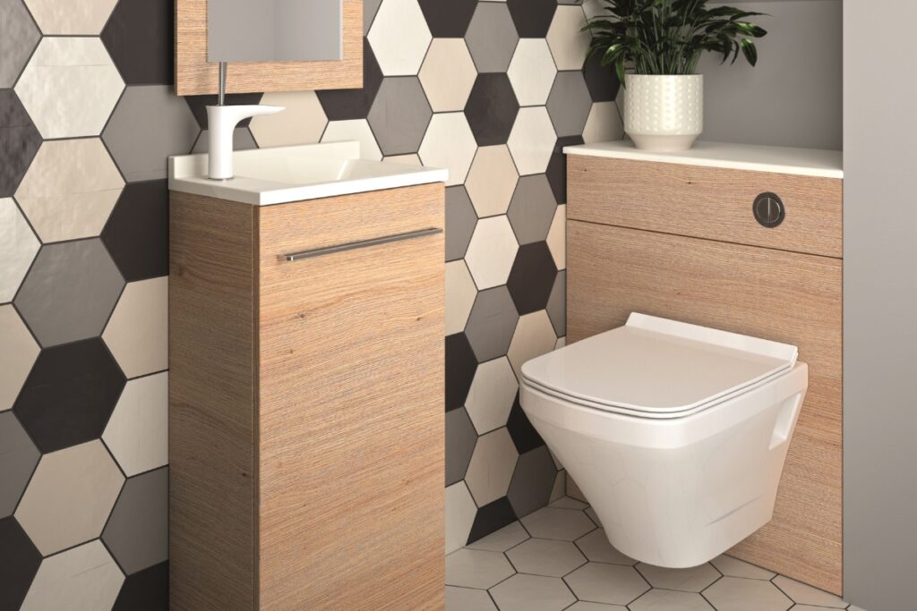 Modern ensuite with a tall wooden vanity, wall-hung toilet, and a contrasting hexagonal tile feature wall.