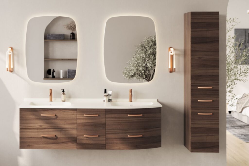 A modern double vanity with dark wood cabinets, curved drawers, rose gold hardware, and two backlit rounded rectangular mirrors.